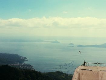 Scenic view of sea against cloudy sky