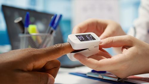Cropped hand of person holding key