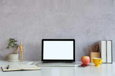 Close-up of laptop on desk