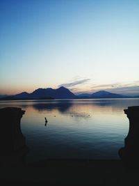 Scenic view of lake at dusk