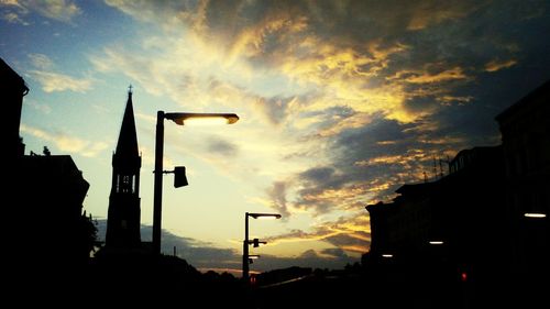 Low angle view of building against cloudy sky