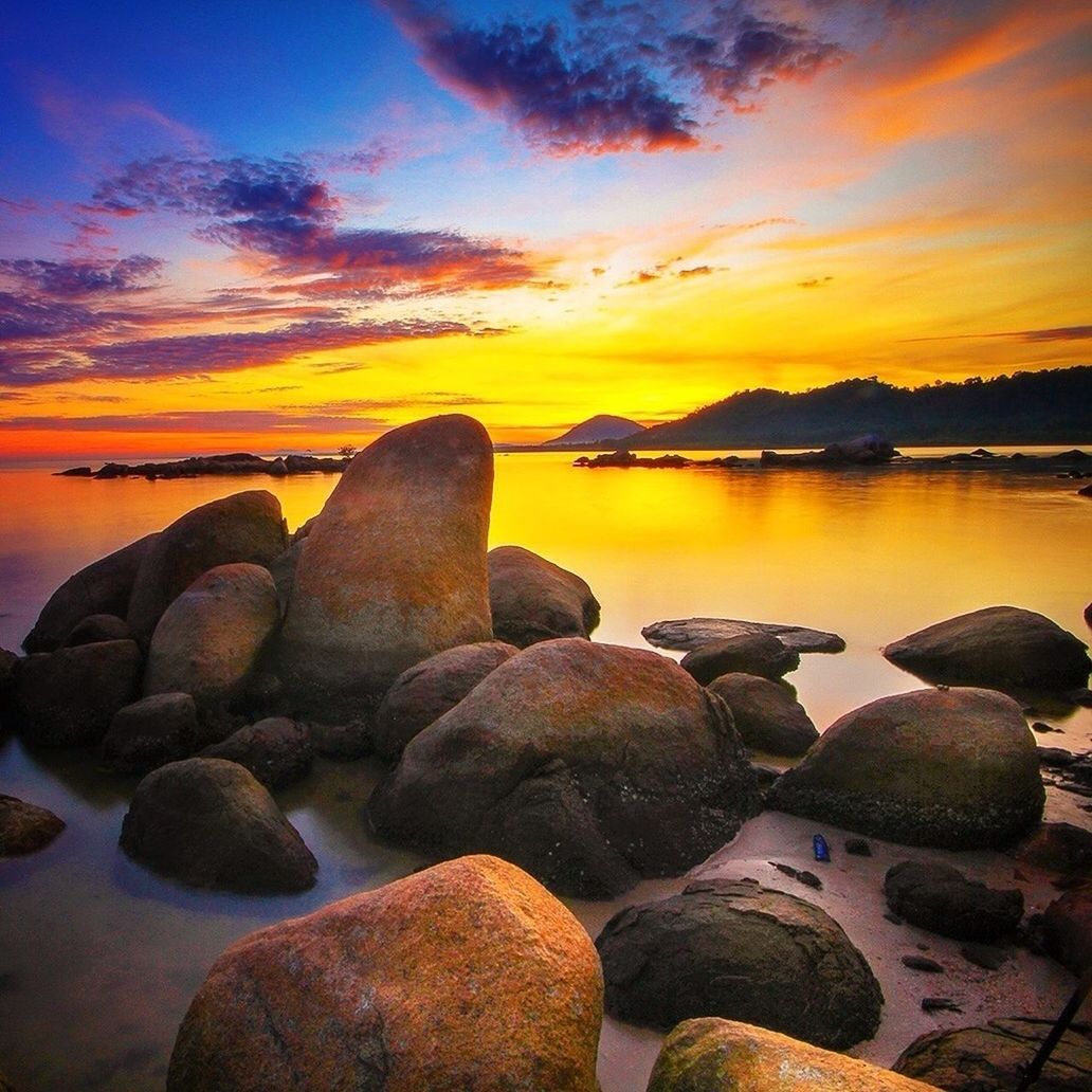 sunset, water, tranquil scene, scenics, tranquility, beauty in nature, sky, rock - object, sea, nature, orange color, idyllic, reflection, stone - object, beach, shore, cloud - sky, rock, dusk, calm