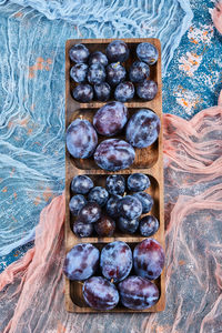 High angle view of grapes in container on table