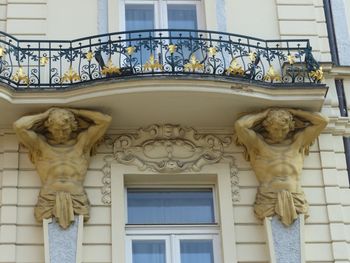 Low angle view of statue against building