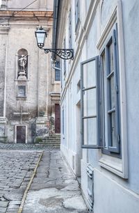 Alley amidst buildings in city