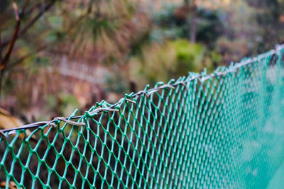 Close-up of ropes on fence