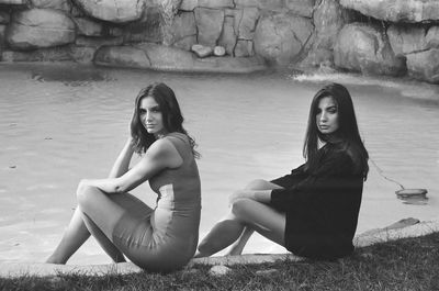 Portrait of smiling young woman sitting outdoors