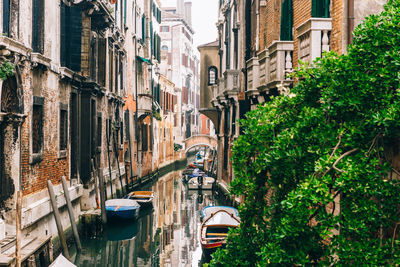 Canal amidst buildings in city