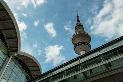 Low angle view of building against cloudy sky