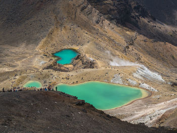 Scenic view of volcanic landscape and lake