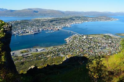 Aerial view of cityscape by sea 