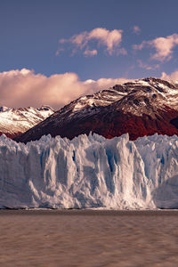 Scenic view of glacier mountains against sky