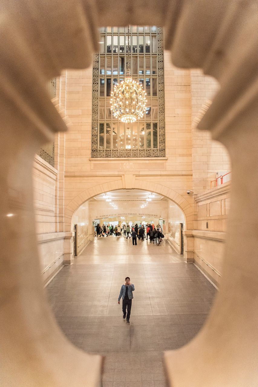 architecture, built structure, group of people, indoors, illuminated, travel, real people, walking, crowd, people, city, travel destinations, lifestyles, modern, tourism, blurred motion, incidental people, adult, building, flooring, architectural column, ceiling