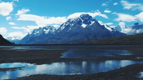 Scenic view of snowcapped mountains against sky