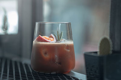 Close-up of cocktail in glass on table