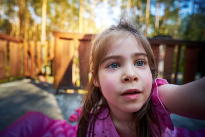 Portrait of cute girl looking down