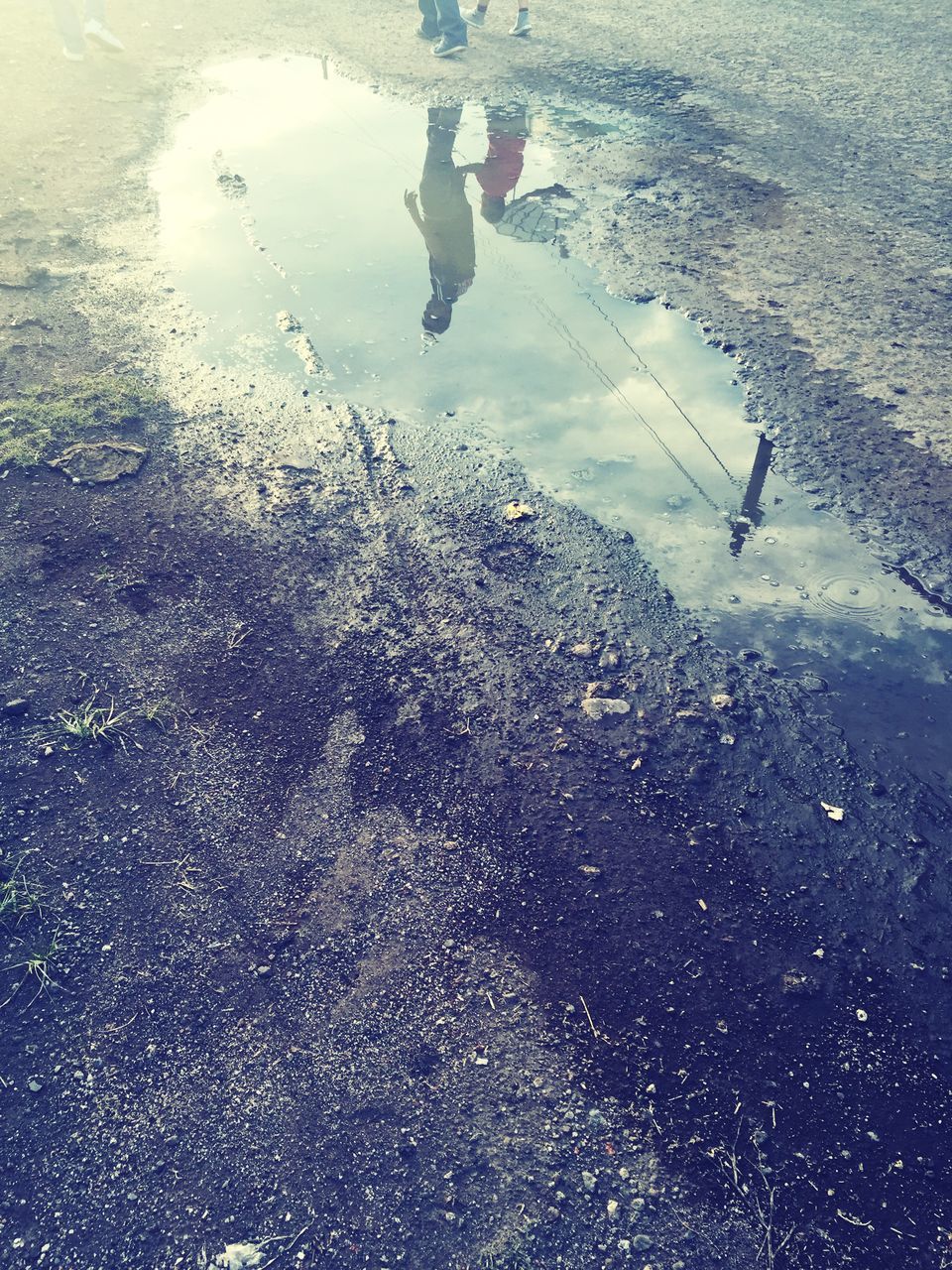 water, wet, transportation, street, rain, high angle view, road, puddle, season, reflection, weather, mode of transport, asphalt, car, transparent, day, drop, road marking, nature, glass - material