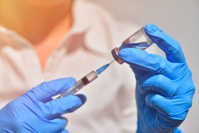 Close-up of human hand holding umbrella