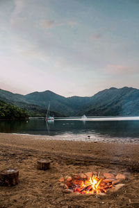 Scenic view of lake against mountain range