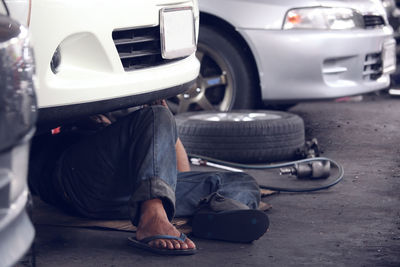 Low section of man in car on street