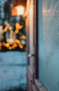 Defocused image of illuminated lights seen through window