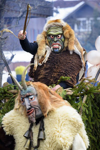 Public and traditional parade with funny masks at carnival