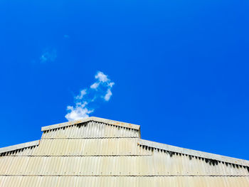 Low angle view of building against blue sky