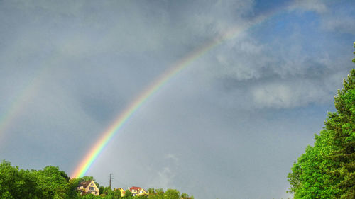Low angle view of rainbow against sky