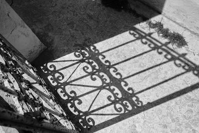 High angle view of bicycle parked on footpath