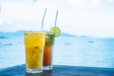 Drink in glasses against sea