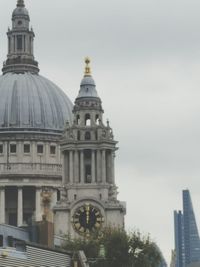 Low angle view of statue against sky in city