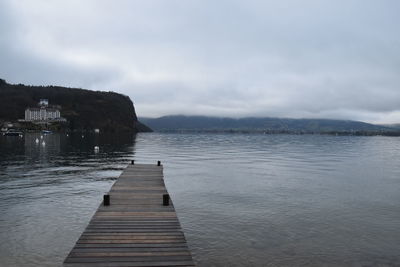 Pier over sea against sky