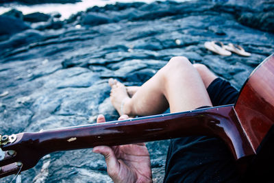 Midsection of woman playing in water