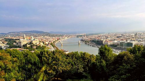 High angle view of river with city in background