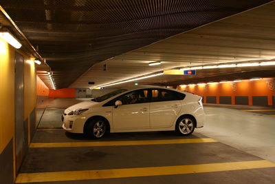 Car in illuminated tunnel