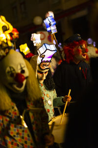 Basel, switzerland - february 19th 24. close-up of carnival drummers in costumes with head lanterns