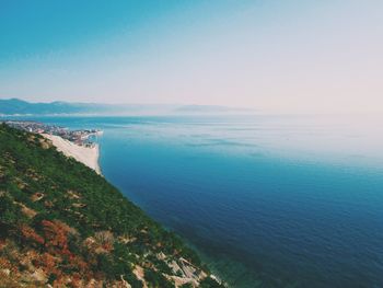 Scenic view of sea against clear blue sky