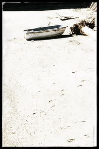 Boats moored on beach