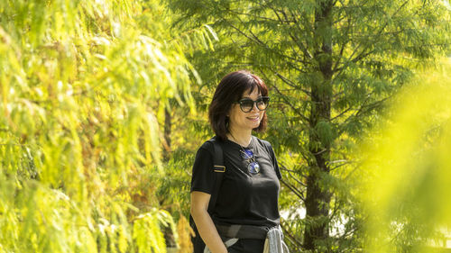 Wonan standing on the pine tree forest