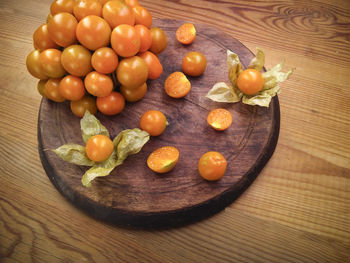 High angle view of oranges on cutting board