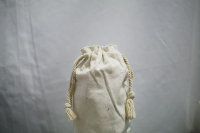 Close-up view of white bag against wall