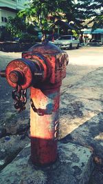 Close-up of fire hydrant on sidewalk