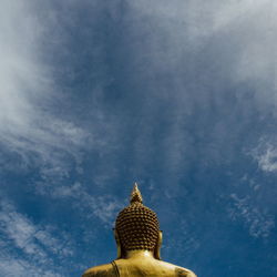 Low angle view of statue against sky