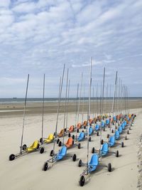 Panoramic view of boats on beach against sky