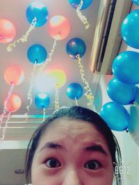 Colorful balloons against blue sky