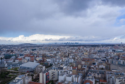 High angle view of city against cloudy sky