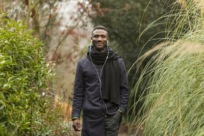 Portrait of smiling man standing on land