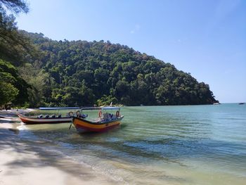 Boat in sea against sky