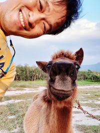 Portrait of woman against sky