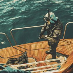 High angle view of man on boat at sea